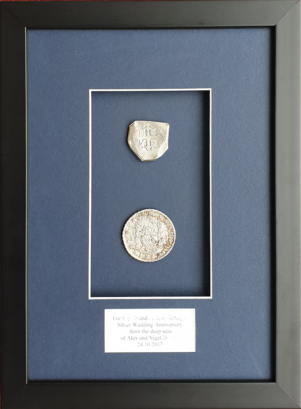 Coins in a box frame